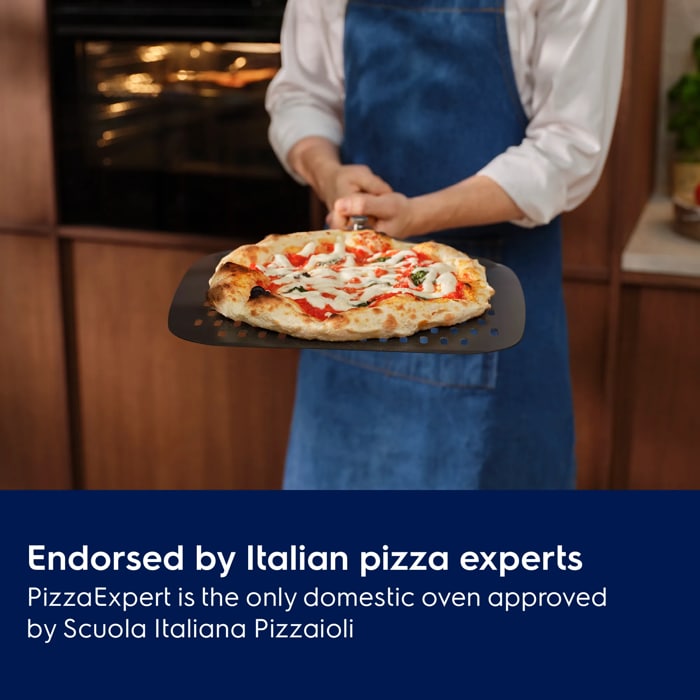 Person holding the pizza expert pizza peel with a Neapolitan pizza
