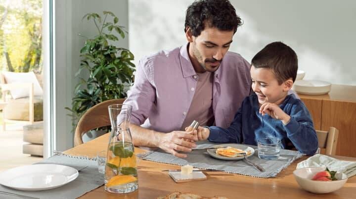 Father and son having breakfast
