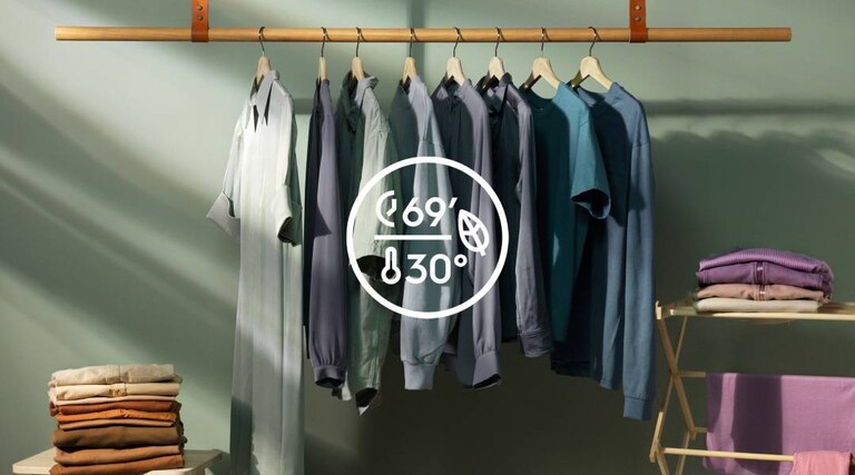 Clean clothes hanging on a clothes rack, washed at 30 degrees temperature to save energy