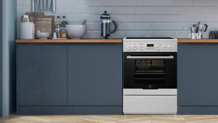 An Electrolux cooker with an oven is placed in a stylish kitchen environment
