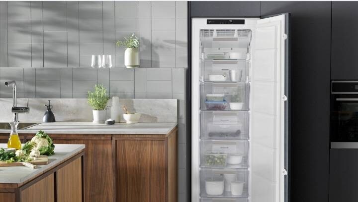 An open freezer showing several convenient compartments to store food